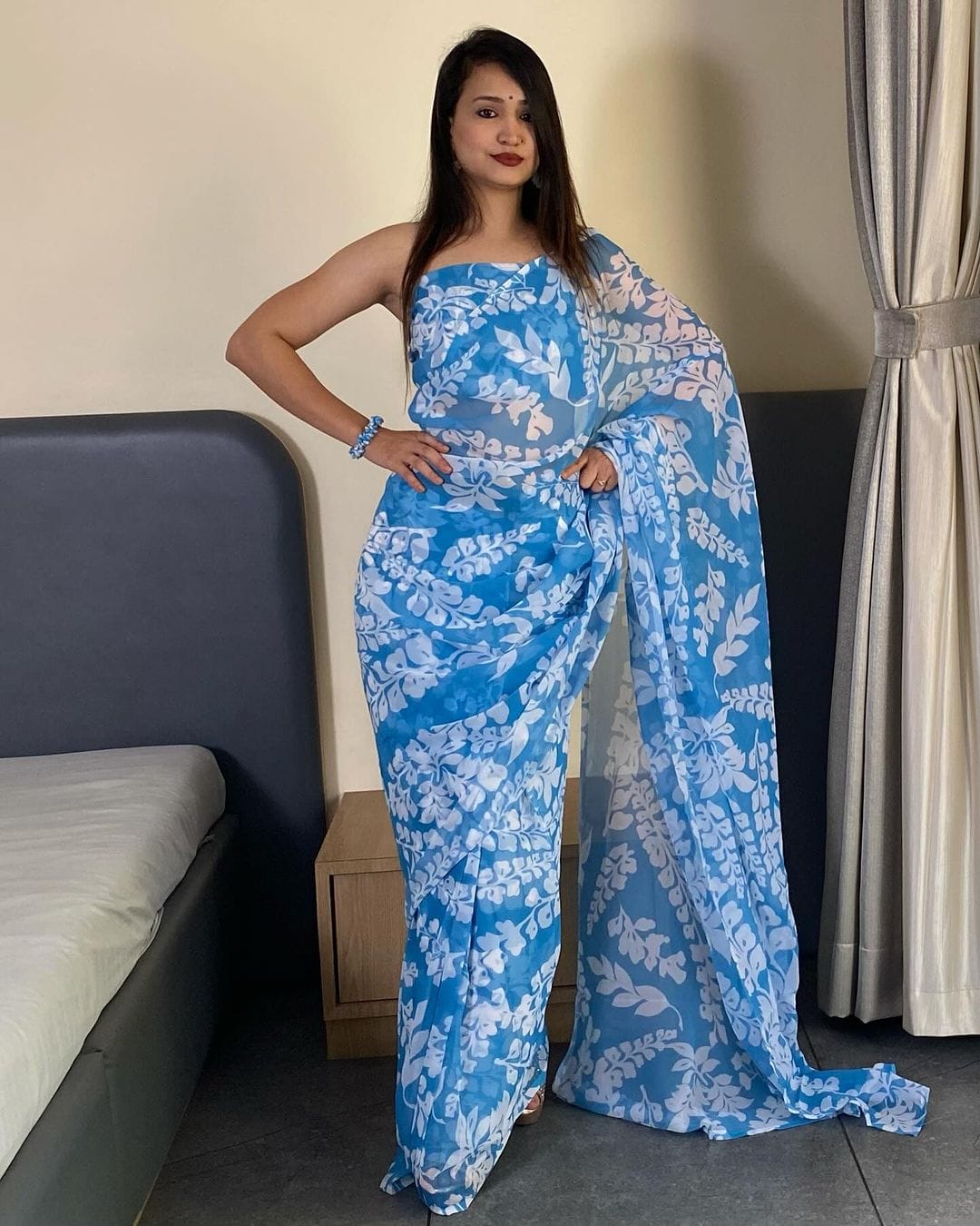 Elevate Your Wardrobe with This Stunning Firozi Georgette Saree