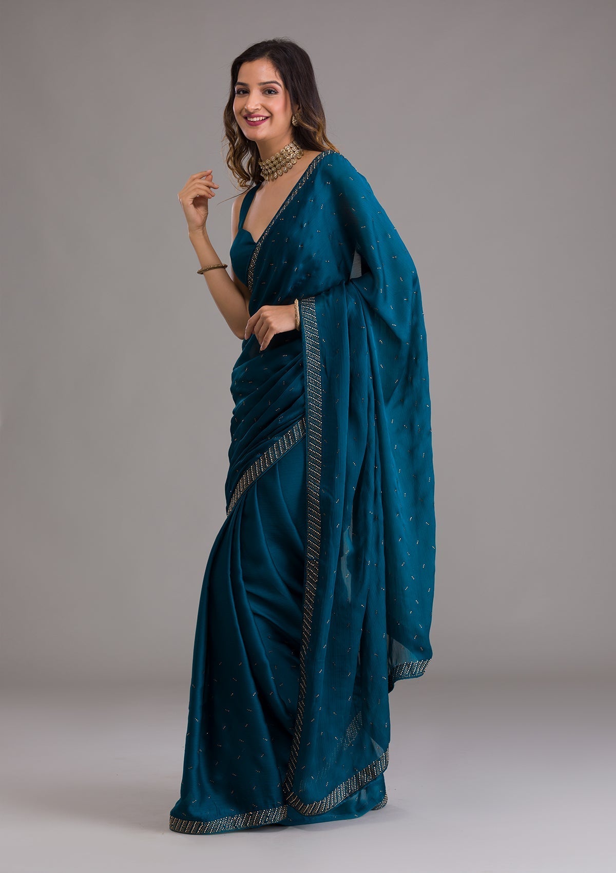 Teal Semi Crepe Saree with Silver Stonework – Elegant Celebration Wear