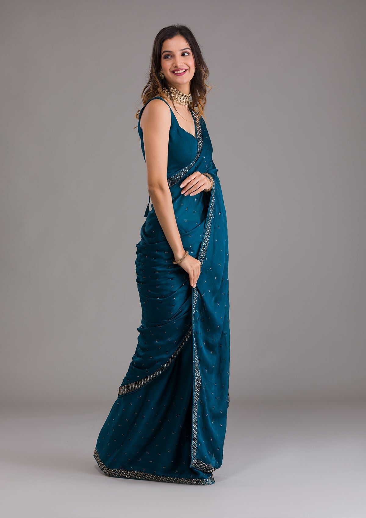 Teal Semi Crepe Saree with Silver Stonework – Elegant Celebration Wear